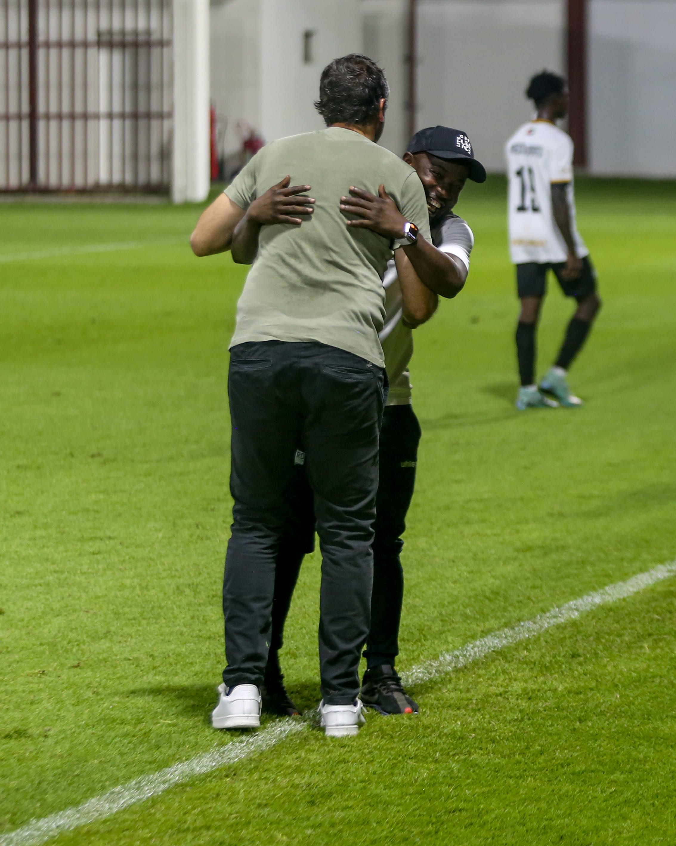 Maestro players and staff embracing after the match